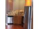 Kitchen with wood cabinets, granite countertops, and stainless steel appliances at 898 Oak Sw St # 3108, Atlanta, GA 30310