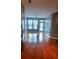 Living room with hardwood floors, access to patio, and ceiling fan at 898 Oak Sw St # 3108, Atlanta, GA 30310