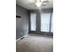 Spacious bedroom with two windows, neutral walls, and carpet flooring at 898 Oak Sw St # 3108, Atlanta, GA 30310