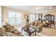 Bright living room featuring comfortable seating and large windows at 221 Edinburgh Ln, Woodstock, GA 30188