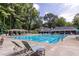 Inviting community pool with lounge chairs at 652 Trailwood Sw Ln, Marietta, GA 30064