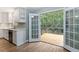 Kitchen with white cabinets, deck access, and stainless steel appliances at 178 Seals Dr, Dallas, GA 30157