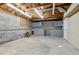 Unfinished basement with garage access and workshop area at 178 Seals Dr, Dallas, GA 30157
