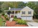 Ranch style home with a two-car garage and landscaped yard at 178 Seals Dr, Dallas, GA 30157