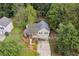 Aerial view of a house with a three-car garage and landscaped yard at 178 Seals Dr, Dallas, GA 30157