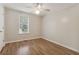Bright bedroom with wood-look floors and ceiling fan at 178 Seals Dr, Dallas, GA 30157