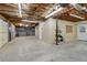 Unfinished basement with garage access and workshop area at 178 Seals Dr, Dallas, GA 30157