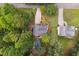 Aerial view of two houses with a wooded backyard and a pool at 178 Seals Dr, Dallas, GA 30157