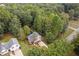 Aerial view of a house with a large backyard and surrounding trees at 178 Seals Dr, Dallas, GA 30157
