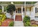 Inviting front porch with white columns and steps at 178 Seals Dr, Dallas, GA 30157