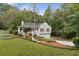 House exterior showcasing a two-car garage and spacious yard at 178 Seals Dr, Dallas, GA 30157