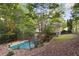 Home with in-ground pool and safety cover in wooded backyard at 178 Seals Dr, Dallas, GA 30157