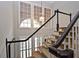 Elegant staircase with dark wood railings and patterned carpeting at 3021 Margaret Mitchell Dr # 8, Atlanta, GA 30327