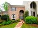 Brick townhouse with a charming walkway and landscaping at 3021 Margaret Mitchell Dr # 8, Atlanta, GA 30327