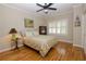 Cozy bedroom with hardwood floors, window shutters and ceiling fan at 3021 Margaret Mitchell Dr # 8, Atlanta, GA 30327