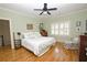 Spacious bedroom with hardwood floors, a ceiling fan, and large windows at 3021 Margaret Mitchell Dr # 8, Atlanta, GA 30327