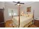 Spacious bedroom featuring hardwood floors and a charming four-poster bed at 3021 Margaret Mitchell Dr # 8, Atlanta, GA 30327