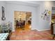 Sunroom with terracotta tile flooring and view into dining area at 3021 Margaret Mitchell Dr # 8, Atlanta, GA 30327