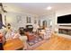 Cozy living room with hardwood floors, fireplace, and eclectic decor at 3021 Margaret Mitchell Dr # 8, Atlanta, GA 30327