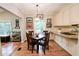 Charming breakfast nook with hardwood floors and view into kitchen at 3021 Margaret Mitchell Dr # 8, Atlanta, GA 30327