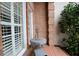 Small brick patio with wrought iron table and chairs, next to the home at 3021 Margaret Mitchell Dr # 8, Atlanta, GA 30327
