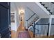 Bright entryway with hardwood floors, staircase, and built-in shelving at 3021 Margaret Mitchell Dr # 8, Atlanta, GA 30327