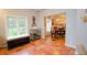 Sunroom with terracotta tile floor and built-in window seat at 3021 Margaret Mitchell Dr # 8, Atlanta, GA 30327