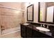 Bathroom with granite-topped double vanity and shower/tub combo at 3021 Margaret Mitchell Dr # 8, Atlanta, GA 30327