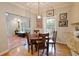 Bright dining area with hardwood floors and access to sunroom at 3021 Margaret Mitchell Dr # 8, Atlanta, GA 30327