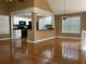 Bright dining room with hardwood floors and a view of the kitchen at 13 Cliff Ct, Villa Rica, GA 30180