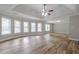 Large bedroom featuring wood-look floors and abundant natural light at 351 Chandler Bluff Ct, Grayson, GA 30017