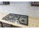 Stainless steel gas cooktop with granite countertop at 222 Gallant Fox Way, Acworth, GA 30102