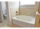 Relaxing bathroom with soaking tub and separate shower at 222 Gallant Fox Way, Acworth, GA 30102