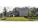 Two-story home with brick and siding exterior, landscaped lawn, and attached garage at 222 Gallant Fox Way, Acworth, GA 30102