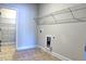 Laundry room with built-in shelving and a utility sink at 222 Gallant Fox Way, Acworth, GA 30102