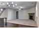 Spacious living room with a stone fireplace and neutral carpet at 222 Gallant Fox Way, Acworth, GA 30102