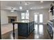 Open concept kitchen with island, stainless steel appliances, and hardwood floors at 222 Gallant Fox Way, Acworth, GA 30102