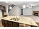 Kitchen island with granite countertop and double sink at 222 Gallant Fox Way, Acworth, GA 30102