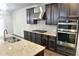 Modern kitchen features stainless steel appliances and granite countertops at 222 Gallant Fox Way, Acworth, GA 30102