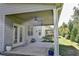 Covered patio with ceiling fan and access to backyard at 222 Gallant Fox Way, Acworth, GA 30102