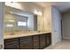 Double vanity bathroom with granite countertops and dark wood cabinets at 222 Gallant Fox Way, Acworth, GA 30102