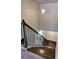 Elegant staircase with dark wood steps and black railing at 222 Gallant Fox Way, Acworth, GA 30102
