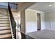 Elegant staircase with dark wood steps and a black metal railing at 222 Gallant Fox Way, Acworth, GA 30102