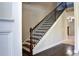 Modern staircase with dark wood and metal accents at 222 Gallant Fox Way, Acworth, GA 30102