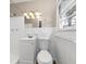 Clean bathroom with white tile and vanity at 6314 Walker Rd, Riverdale, GA 30296