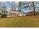 Back of house showing patio and yard at 6314 Walker Rd, Riverdale, GA 30296