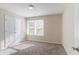 Well-lit bedroom with double door closet and carpet flooring at 280 Green Commons Dr, Covington, GA 30016