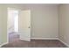Bedroom with carpet flooring and access to hallway at 280 Green Commons Dr, Covington, GA 30016