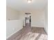 Open dining area with kitchen view and wood-look floors at 280 Green Commons Dr, Covington, GA 30016