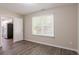 Bedroom with window, wood-look floors and kitchen view at 280 Green Commons Dr, Covington, GA 30016